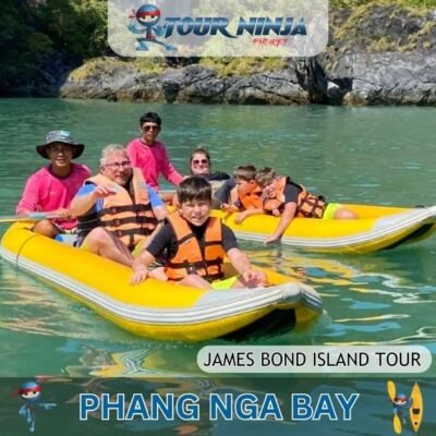 parents with kids sitting with guides in two yellow kayaks while exploring Phang Nga bay