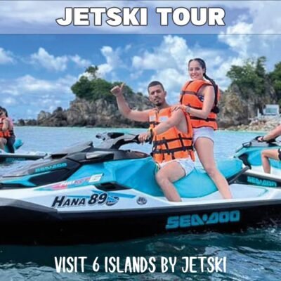 guided jetski tour with a group of eight people on four jetski visiting khai nui island on beautiful sunny day