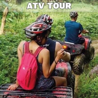 big buddha temple atv tour showing three ATV venhicles being driven by tourists on a dirt road in lush green area