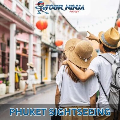 two tourists wearing hats admiring Phuket town street architecture during city tour