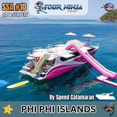 pink speed catamaran boat with large water slider parked in a bay area at koh phi phi islands