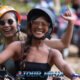 adventure atv fun in phuket with two smiling females riding on a jungle track followed by a group of atv riders