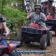 jungle atv tour with a group of happy atv riders following each other on a jungle trail