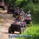 atv riding adventures with a group of atv riders following each other on a jungle trail