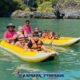 james bond island tour with family of five sitting in two yellow sea canoes with their two local paddle guides