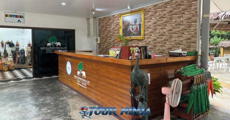 bukit-elephant-amenities-bu1 bukit elephant park timber reception desk in foyer with souvenir shop in the background