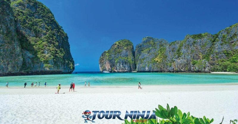 daytrip-phiphi-island-maya-bay-s5 maya bay at phi phi island viewed from the famous maya beach with a clear blue sky and its turquoise blue sea