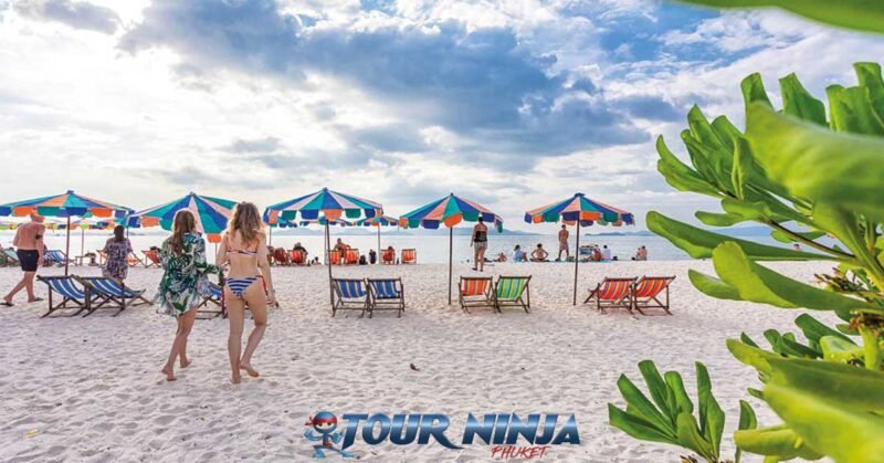 daytrip-phiphi-khai-island-s11 khai island with several tourist enjoying the afternoon sea view in beach chairs with beach umbrellas