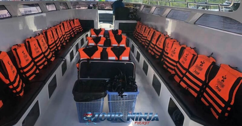 daytrip-snorkeling-phiphi-island-s3 white speedboat viewed from the inside with orange life jackets all perfectly lined up on both sides ready to use