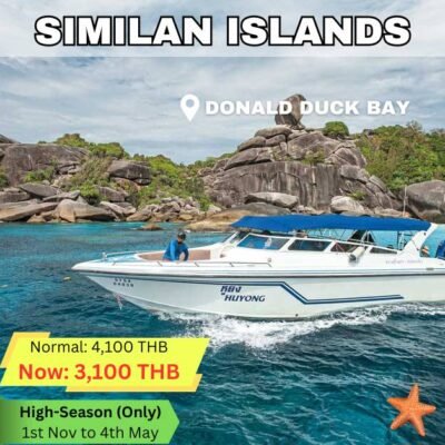 similan island donald duck bay with a white speedboat cruising by with tourists on a daytrip