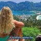 snorkeling tour visiting phi phi islands with a blond hair girl enjoying the amazing view from the famous phi phi view point