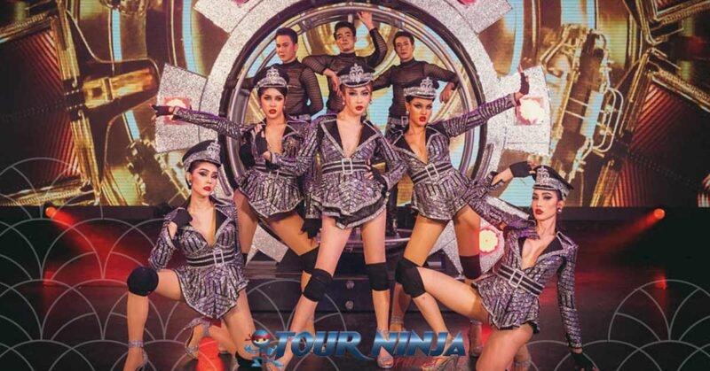 drag-queen-cabaret-show-phuket simon cabaret phuket with a group of drag queen artists dressed in sexy black short uniforms with lots a sparkling on stage