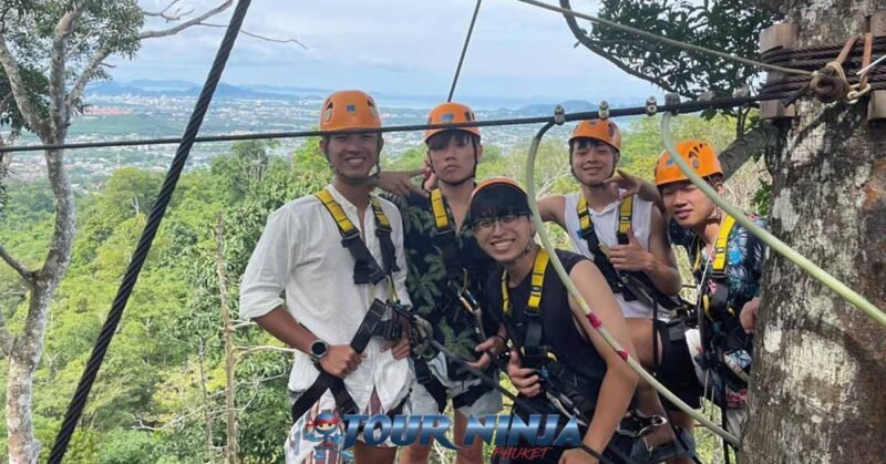extreme-zipline-tours-phuket-pp1 extreme zipline tour with a group of five asian males standing on a zipline platform ready to zipline