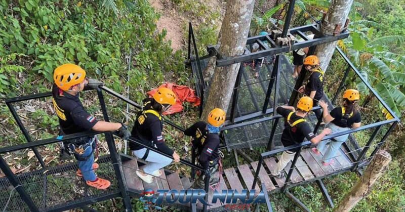 family-friendly-zipline-phuket-pp1 zipline eco tours with six participants on a staircase wearing orange safety helmets