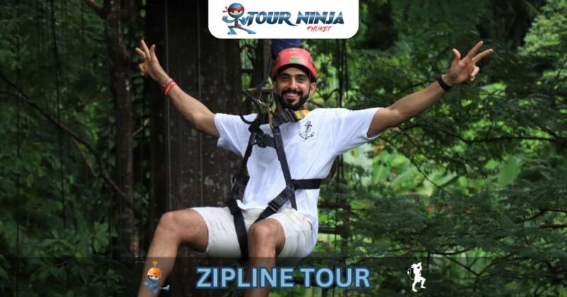 zipline-phuket-flying-hw5 happy bearded man in harness suspended from zipline with outstretched arms