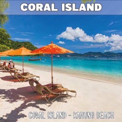 coral island showing kahung beach with beautiful blue sky and turquoise sea with red sun umbrellas and beach chairs
