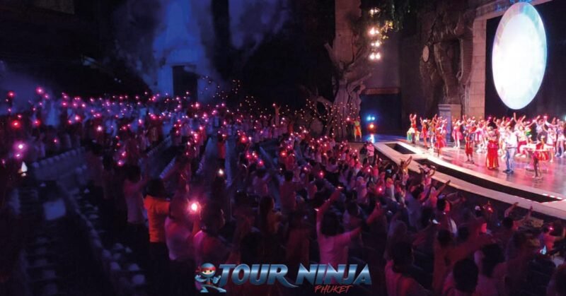 performance-art-theatre-show-1 phuket fantasea theatre show with the spectators standing up with lights in the hands watching the show on stage