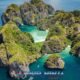 phi phi island aerial showing beautiful turquoise sea and shallow areas around the overgrown limestone island