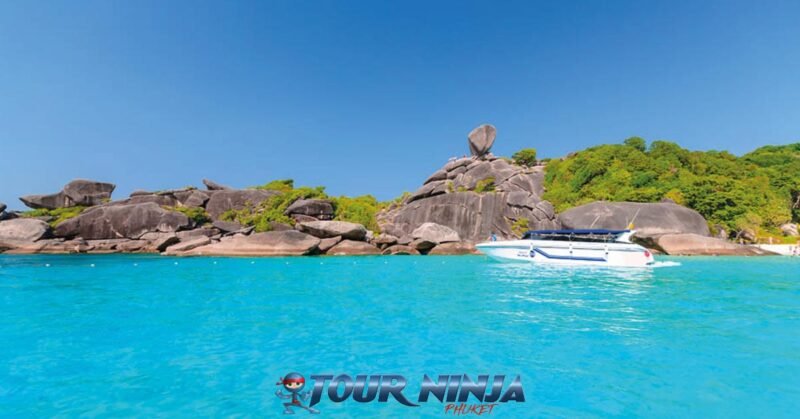similan-island-daytrip-snorkeling-2 similan island with a white speedboat moored up in donald duck bay on a beautiful bright sunny day with its crystal clear sea