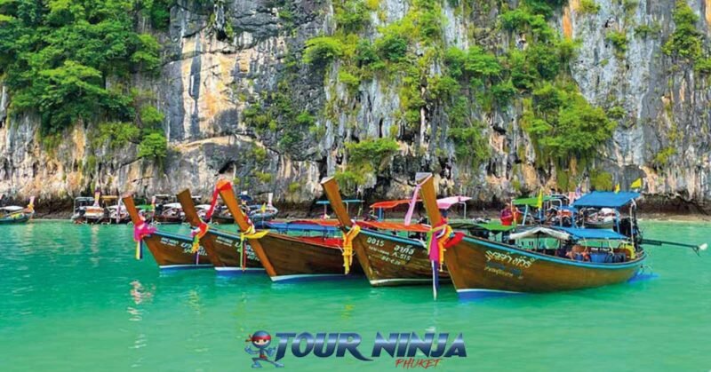 snorkeling-phi-phi-island snorkeling tour visiting phi phi island with several longtail boats moored up side by side