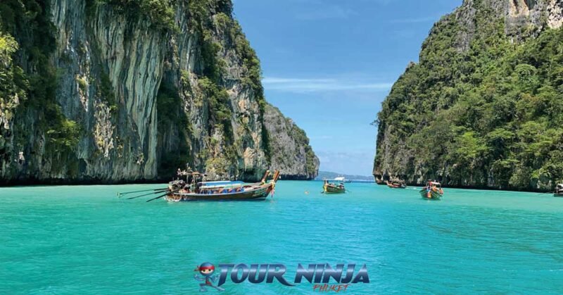 snorkeling-pileh-lagoon-phiphi-island-s6 pileh lagoon phi phi island with 5 longtail boats moored up inside the beautiful lagoon with its clear blue sea