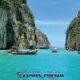 pileh lagoon phi phi island with 5 longtail boats moored up inside the beautiful lagoon with its clear blue sea