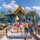 andamanda phuket water park with six smiling teenagers entering into the large adventure water park
